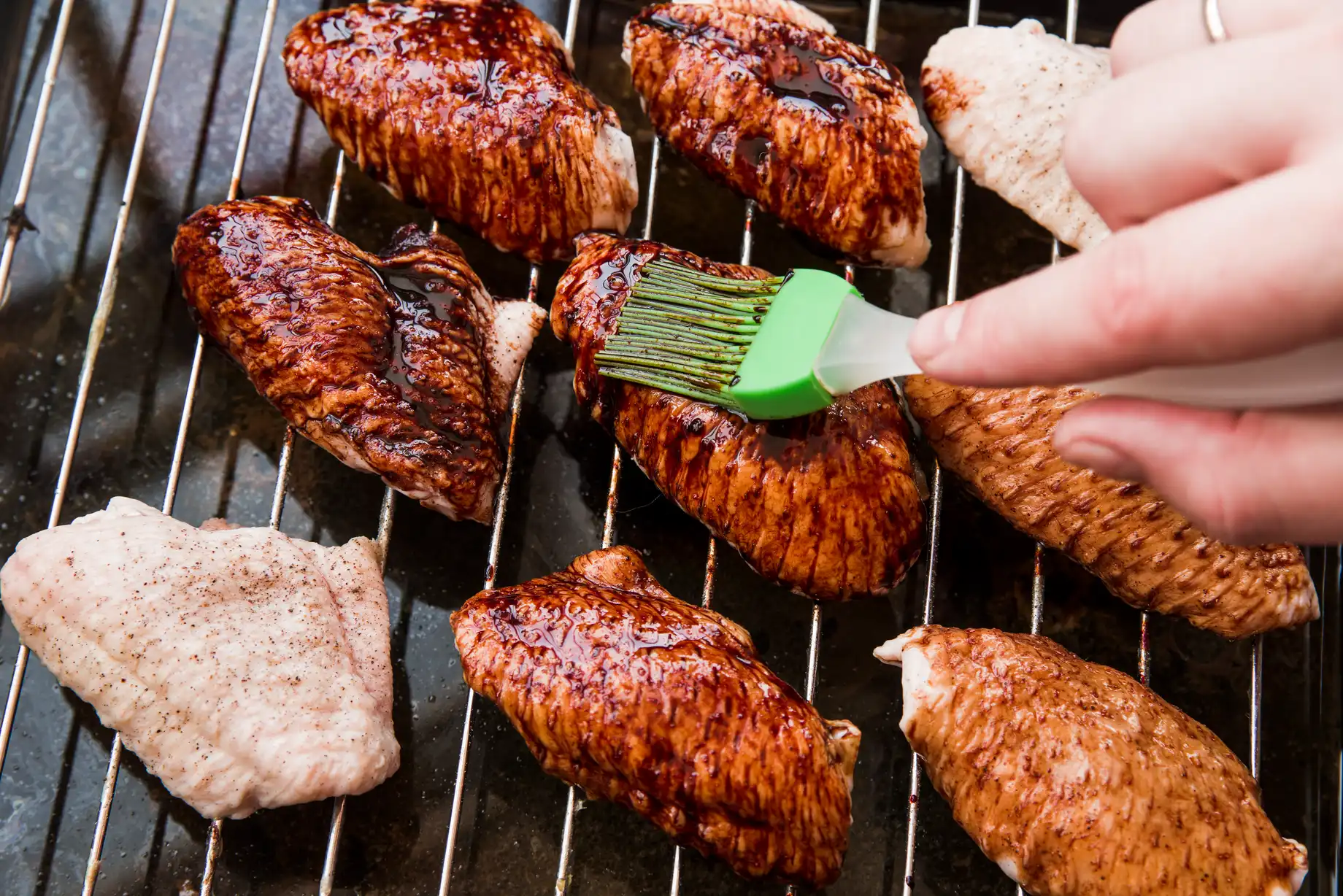 close-up-person-s-hand-applying-oil-roasted-chicken-wings-with-brush BBQ Maintenance